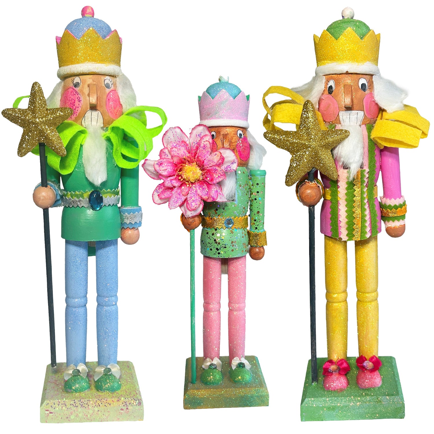 "Hand-painted glitter nutcrackers in vibrant colors, each decorated with unique designs and sparkling details. The nutcrackers are adorned with crowns, capes, and accessories, showcasing a festive and whimsical style.