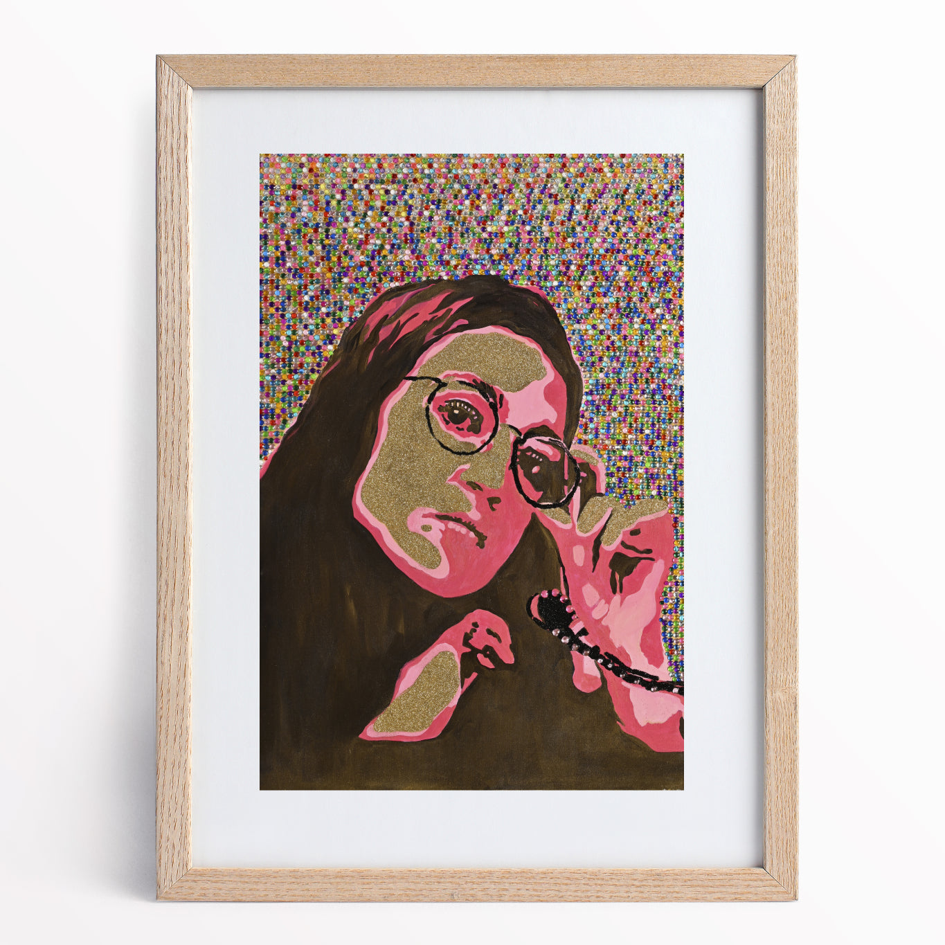 Natalie Zoghby's portrait of Alexandria Ocasio-Cortez archival print. Framed inside a light wood framed and white mat board. AOC is hot pink and gold with a funky look. Jewels cover the background